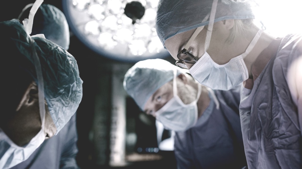 Surgeons in operating room.