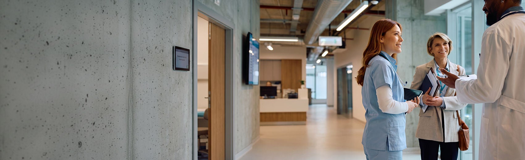 Healthcare professionals discussing with each other in a modern medical facility