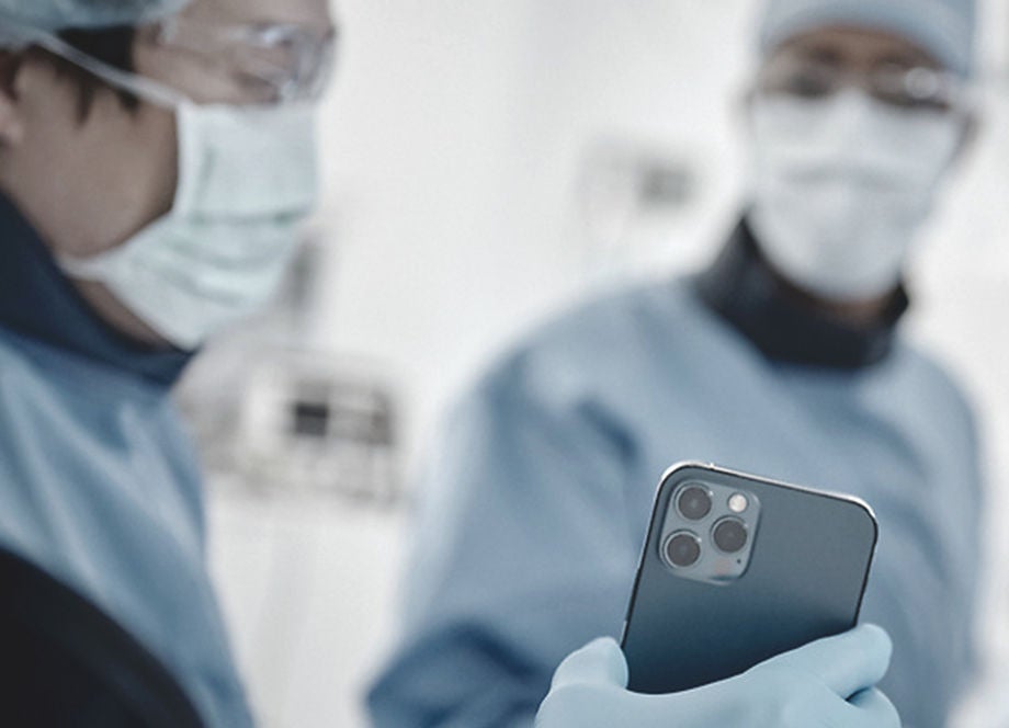 Mike Mahoney Boston Scientific Chairman and CEO smiling from a stage.