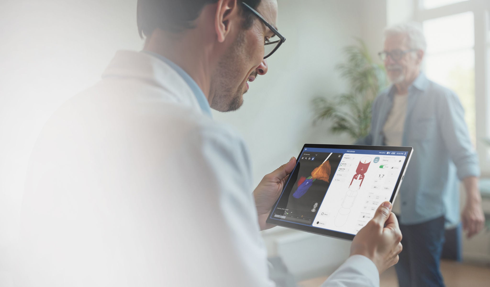 Hands holding VN5 software from Boston Scientific