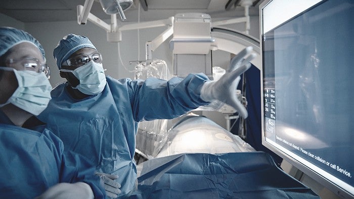 surgeons looking at screen