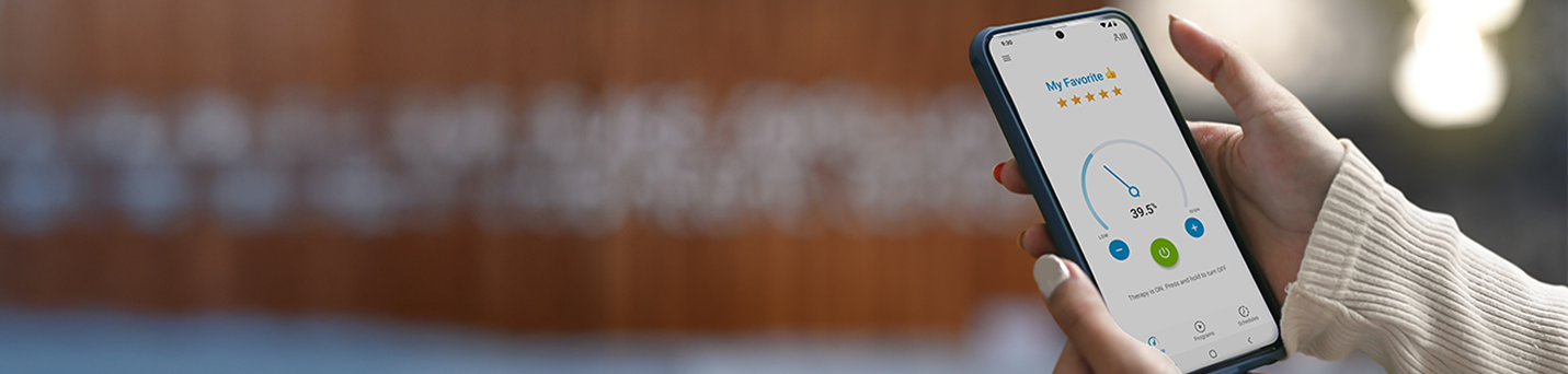 Person using mySCS GO therapy controller.