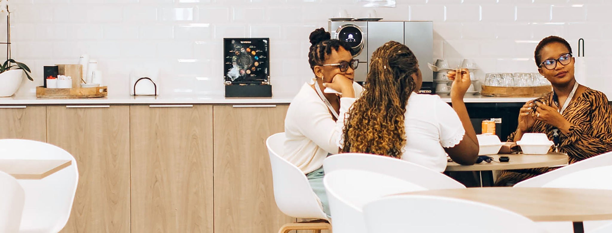 Boston Scientific Asian employee smiling and looking towards laptop.