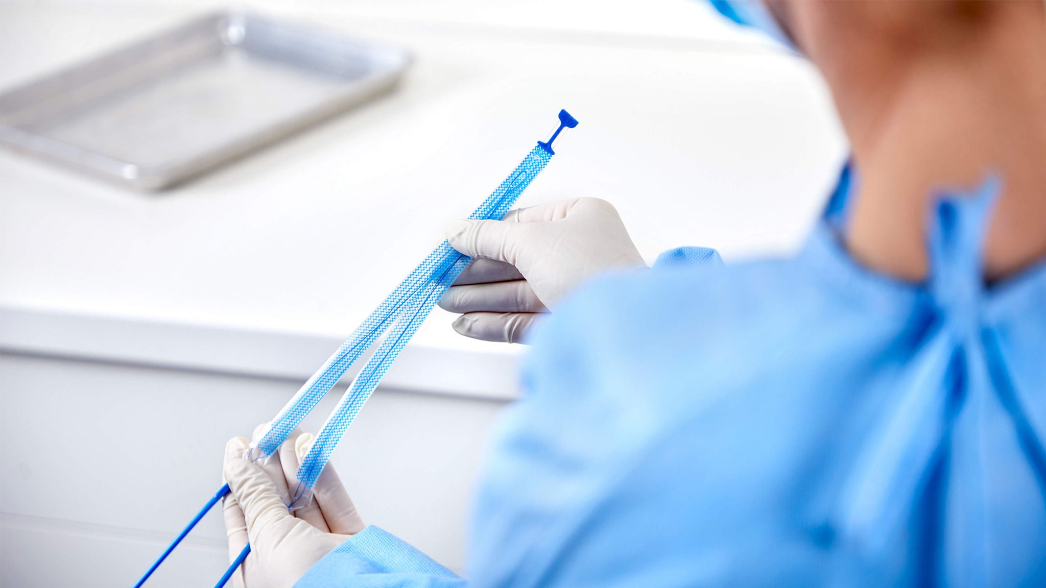 Physician holding Ultra product in OR.