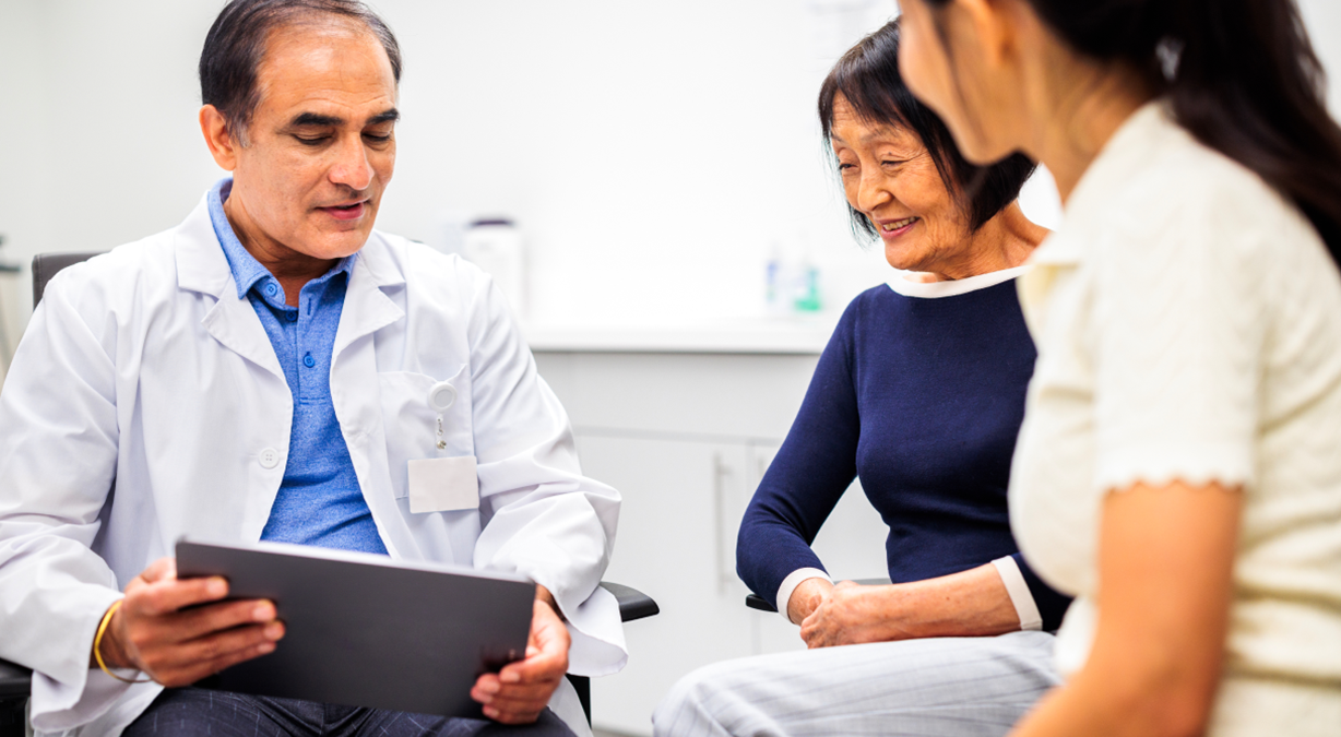 Physician showing patients content on tablet