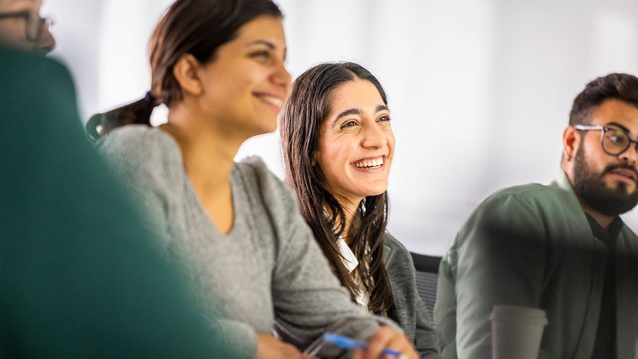 Diverse employees collaborating during a team meeting, reflecting Boston Scientific's inclusive workplace culture.