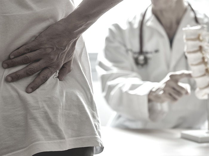 Doctor pointing spinal cord