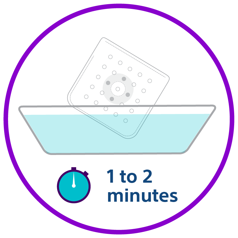 A BioEnvelope being dipped into sterile solution for hydration. 