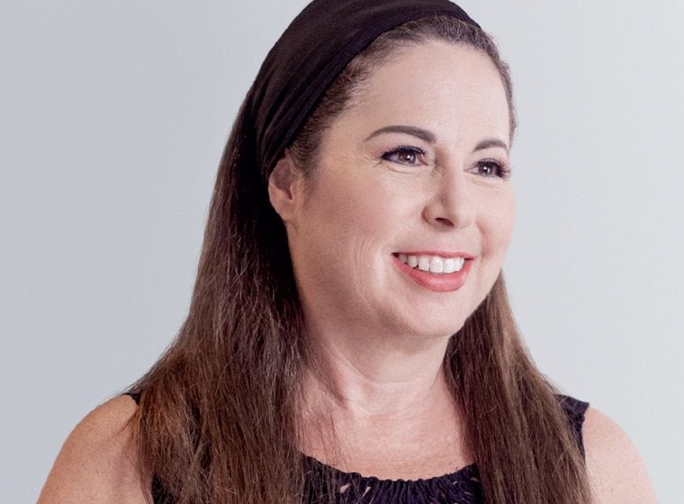 Woman smiling and looking off to the side