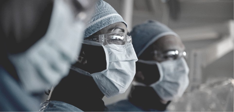 Health care professionals looking at a DBS procedure