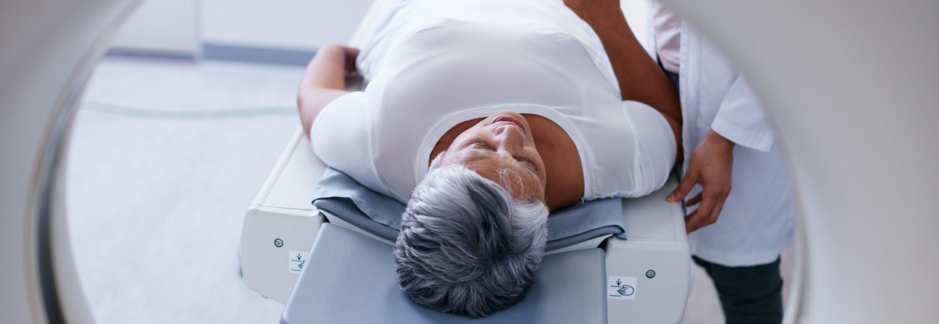 women with smiling face in red dress.
