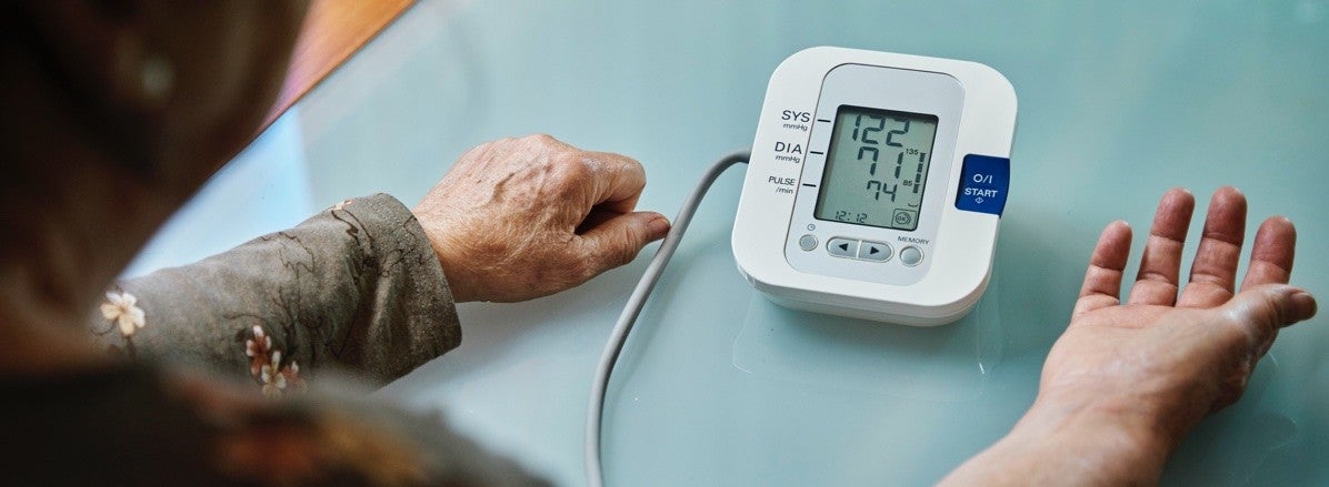 man testing his blood pressure
