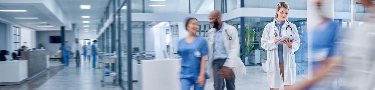 Healthcare professionals working in a modern hospital to improve operational productivity and patient care