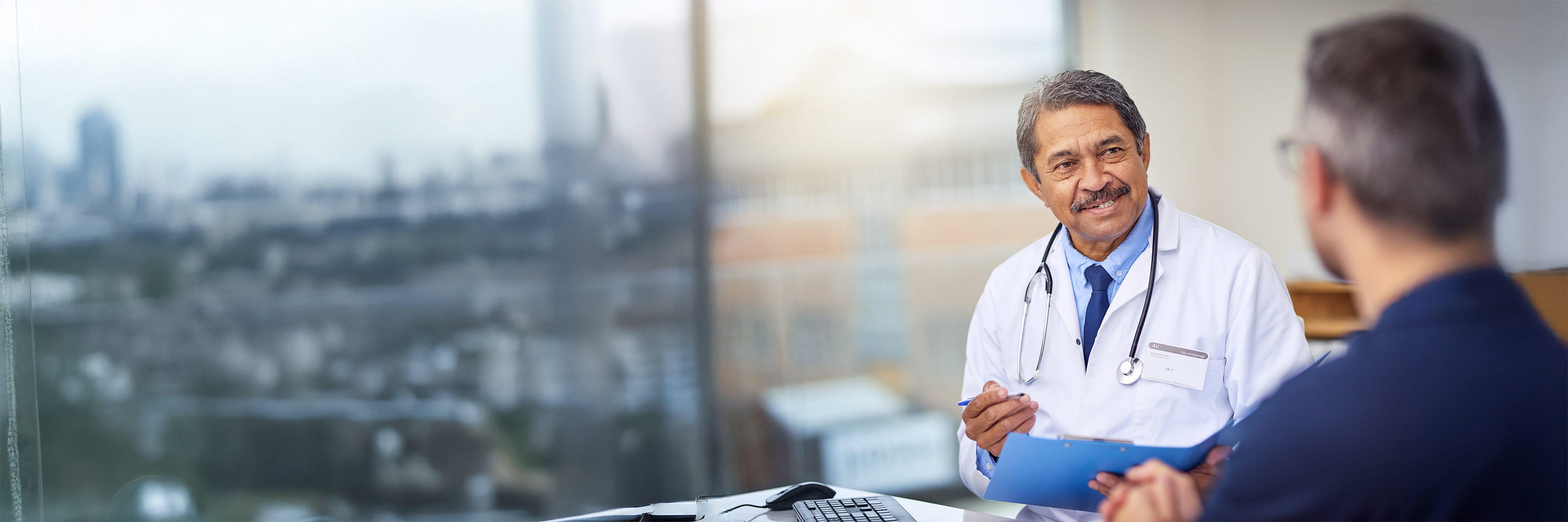 man talking to doctor