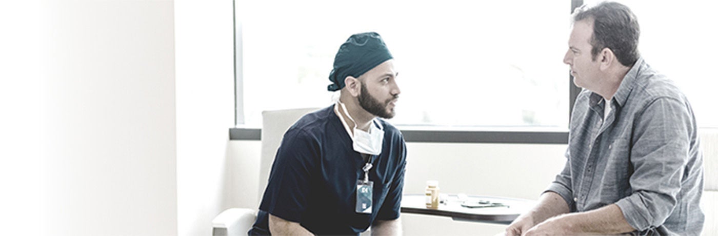 Healthcare provider in discussion with male patient.