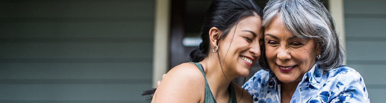 Two women embracing.