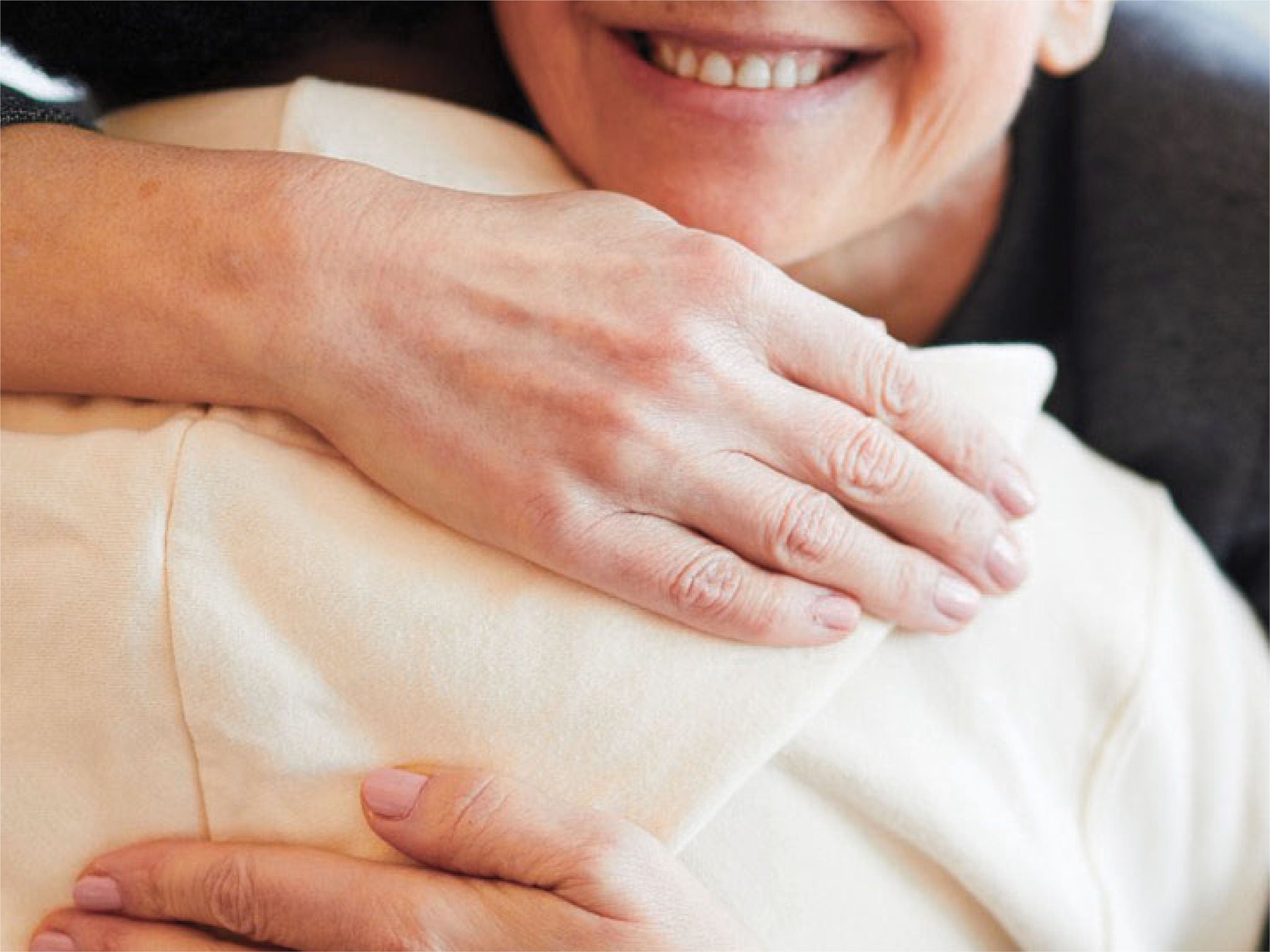 Two people hugging, expressing that if safety matters, you should choose TheraSphere.