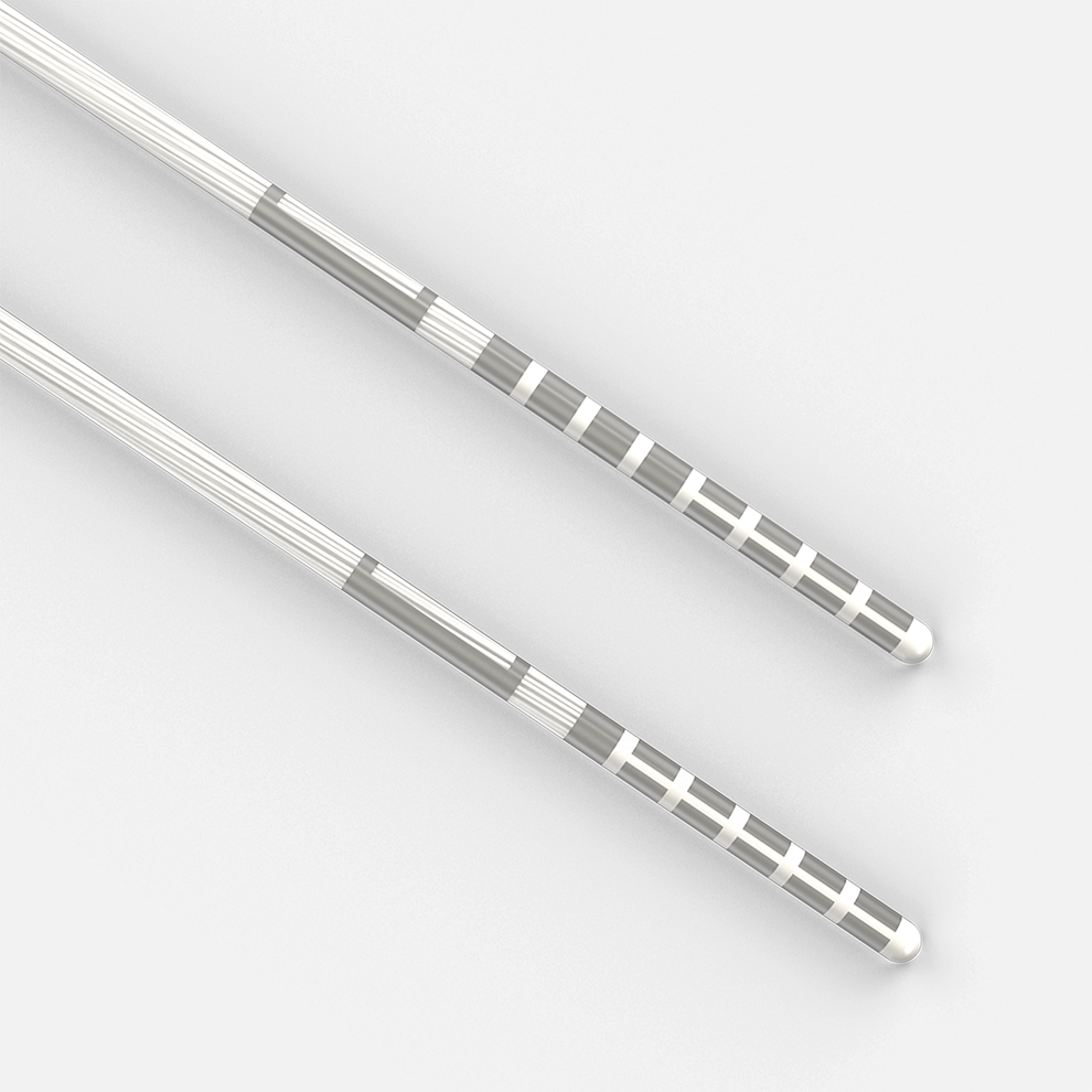 Two metallic catheter leads with segmented electrodes near their rounded tips.