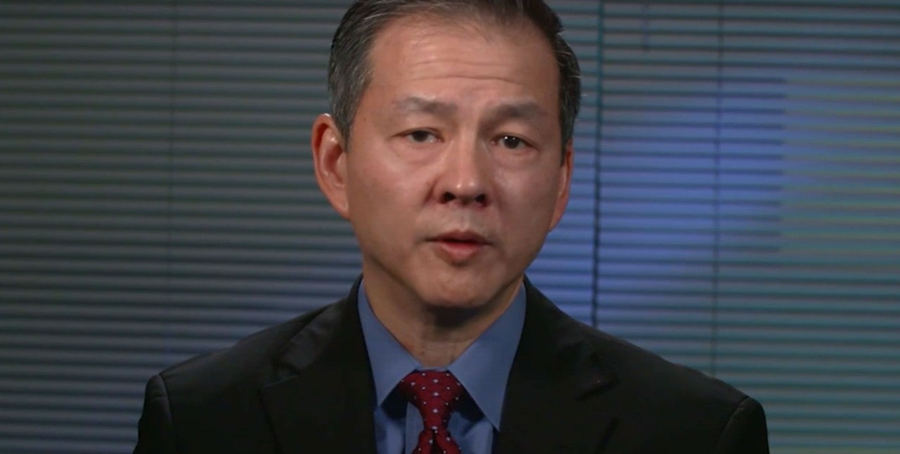 Still from Video. Dr. Hsi looking directly into the camera talking. 