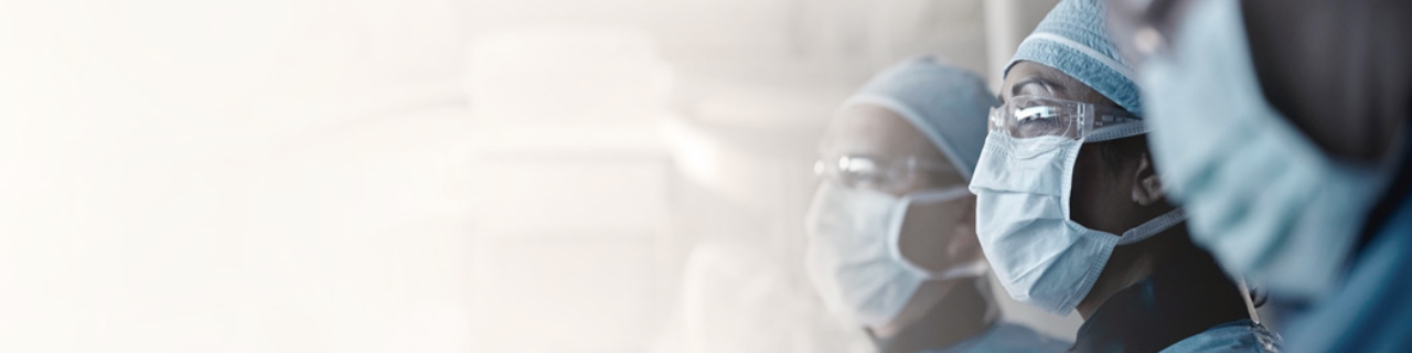 Three healthcare professionals in masks