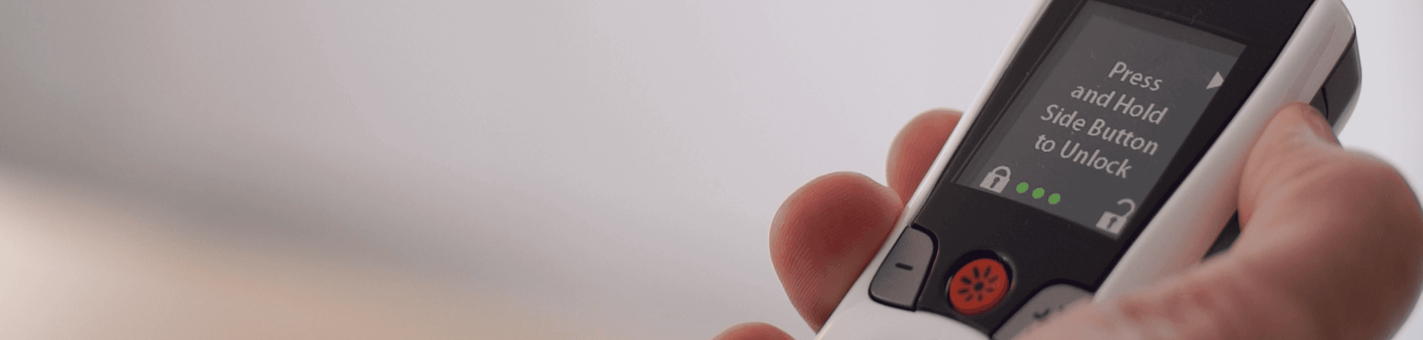 Freelink remote close-up in hand.