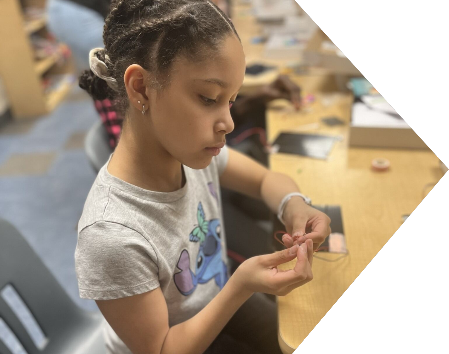 Young girl doing school project inside lab.
