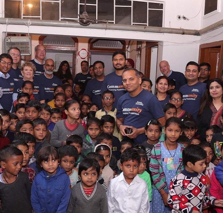group of school children with CSR team member
