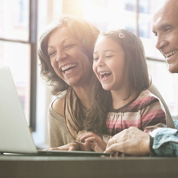 Girl laughing with woman man