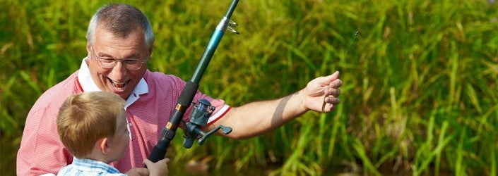Background image of man fishing with a child