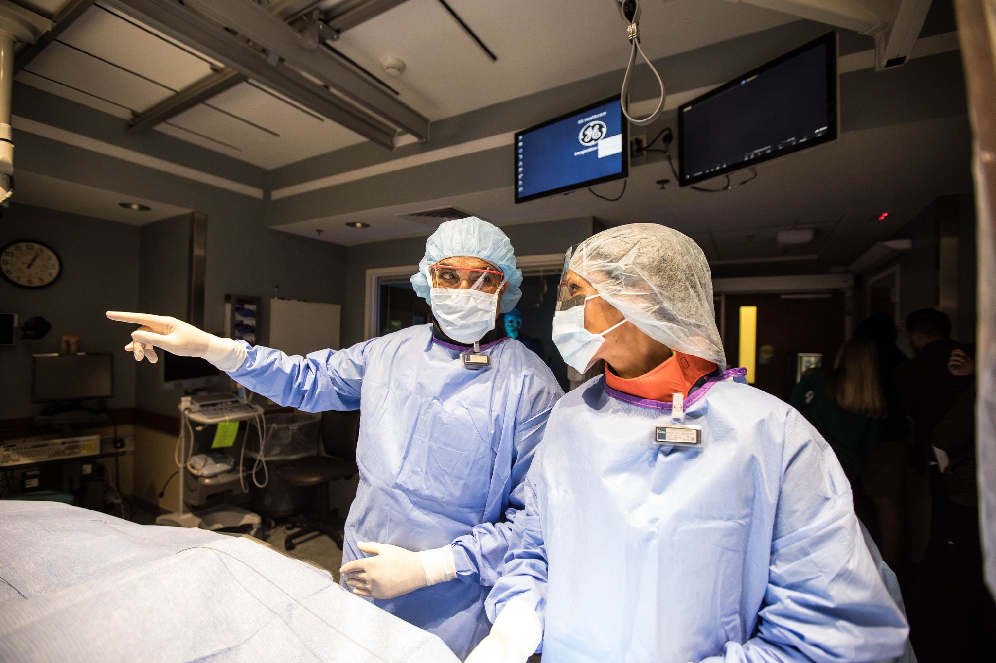 Health care provider working in surgical setting.