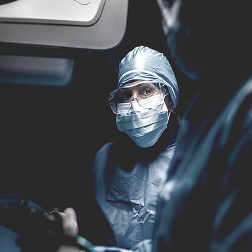 Physician in operating room.