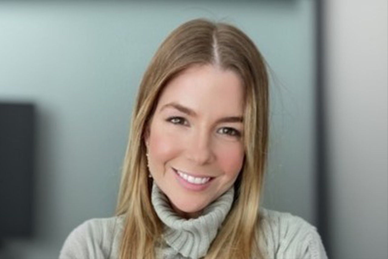 Head shot of smiling white women.
