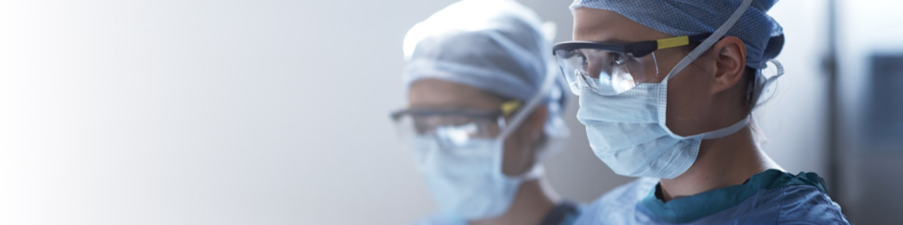 Two healthcare professionals in masks