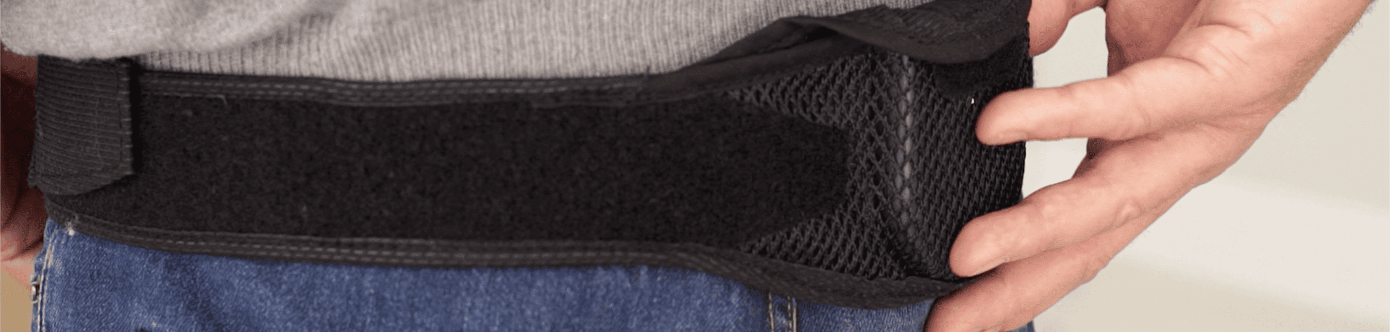 close-up of SCS charging belt on man's waist.