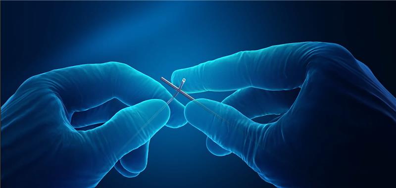Two gloved hands holding TruSelect.