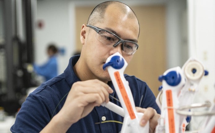 men wearing protective glass doing experiment