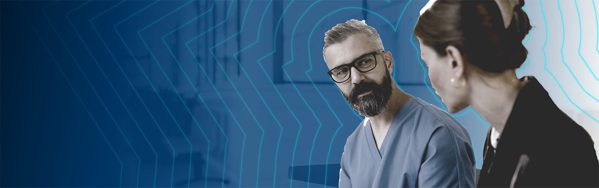 Healthcare provider and administrator talking with each other.