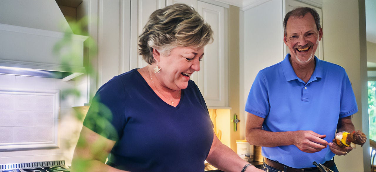 Man and woman preparing dinner.