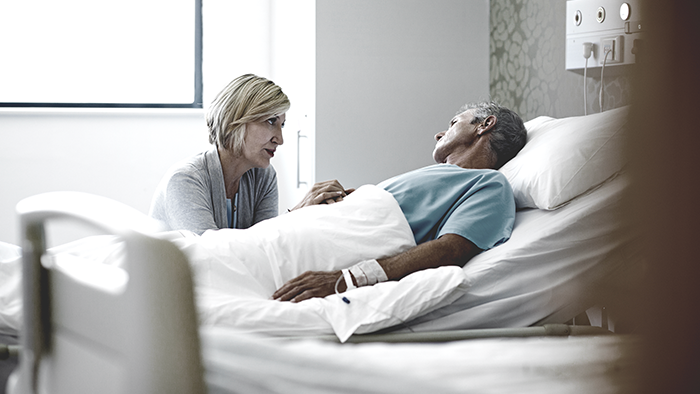 Patient laying on hospital bed