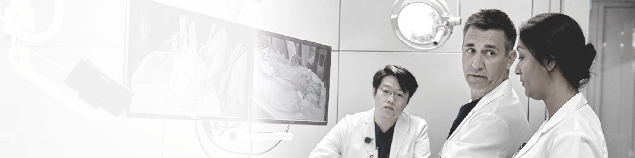 Health care professionals looking at a DBS procedure 