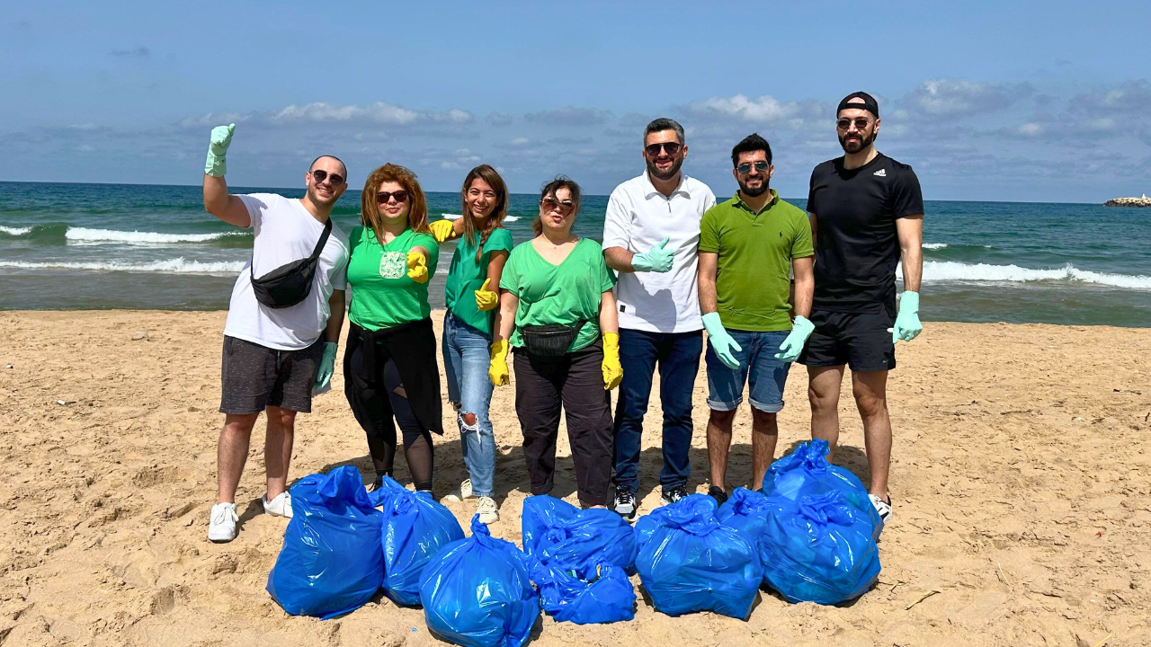 Upward view of trees against clear blue sky.