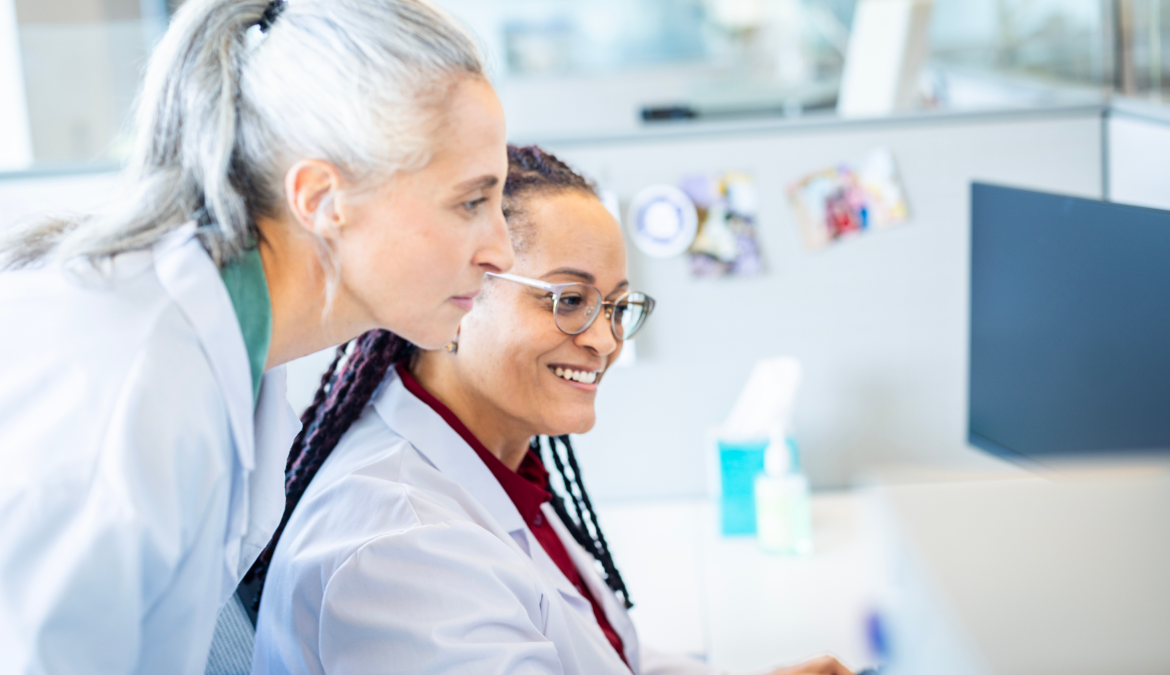 Patient education specialist shows patient content ipad