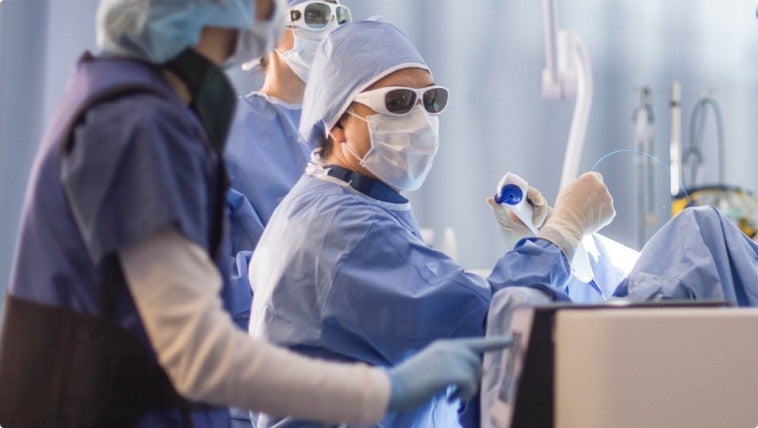 Doctors doing medical procedure.