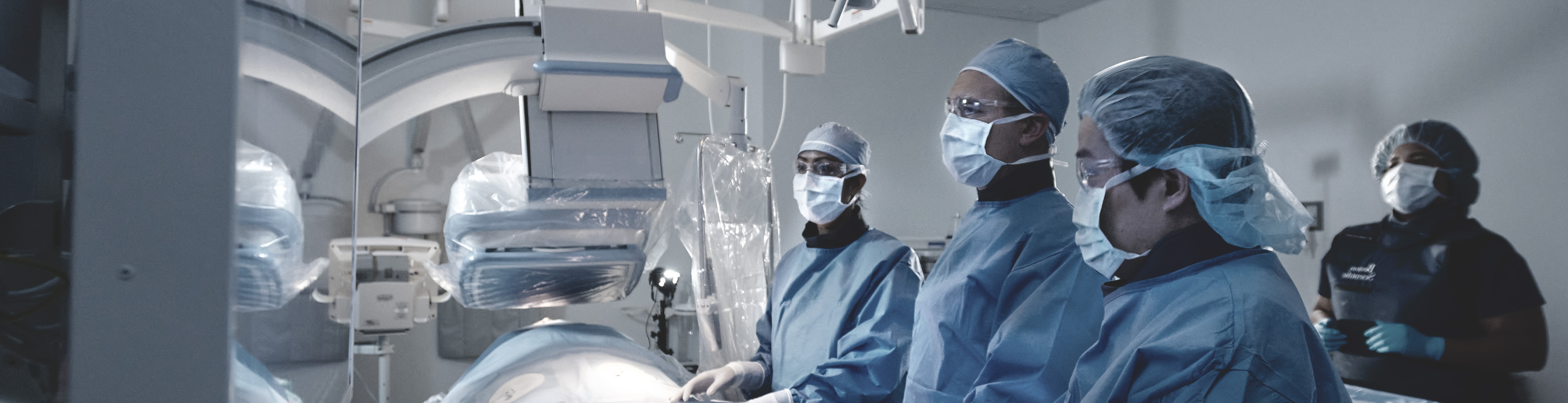Healthcare professionals with a scrub caps and masks