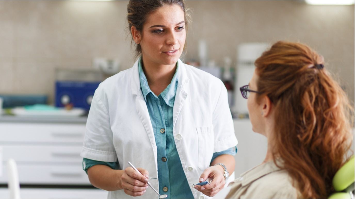 Doctor speaking with a patient in the doctor’s office 