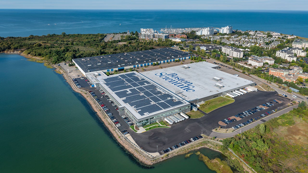 Aerial view of large waterfront Boston Scientific campus.