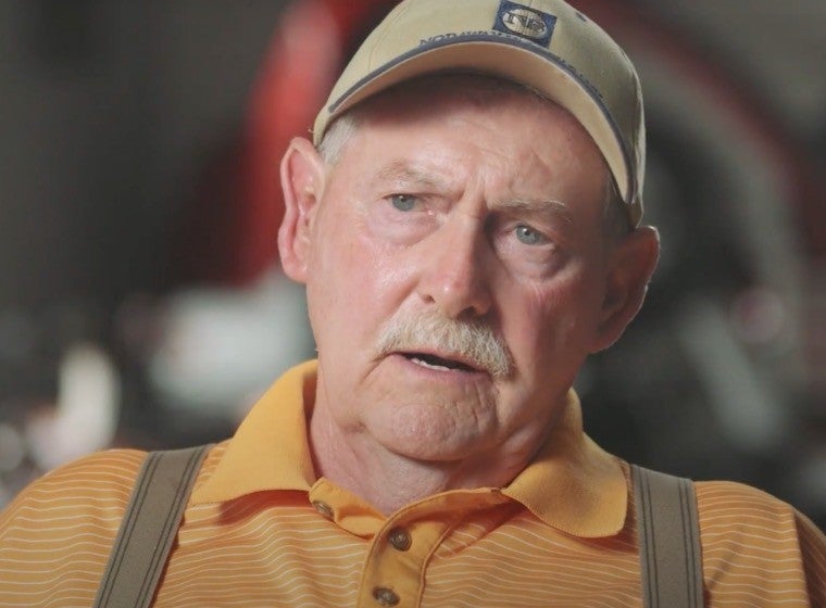 Man in a cap looking straight ahead 