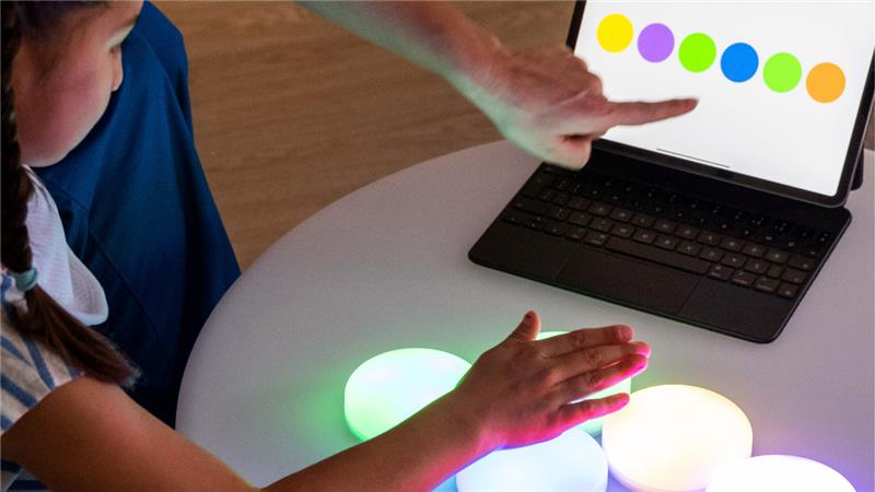 Elderly woman and young child smiling at each other