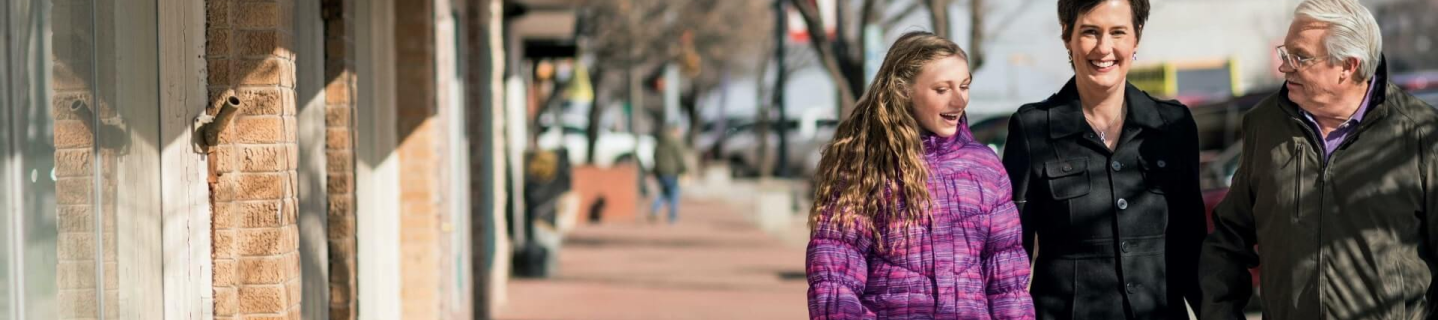 Patient ambassador Karen and family outdoors.