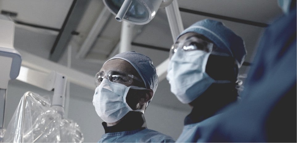 Health care professionals looking at a DBS procedure